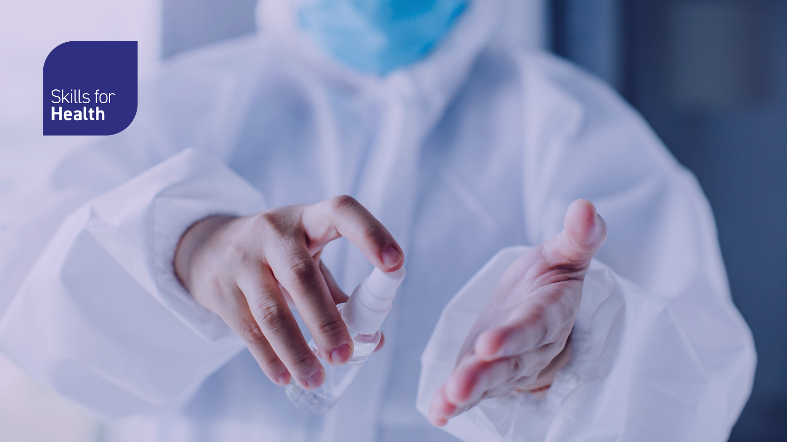 Person in PPE washing hands