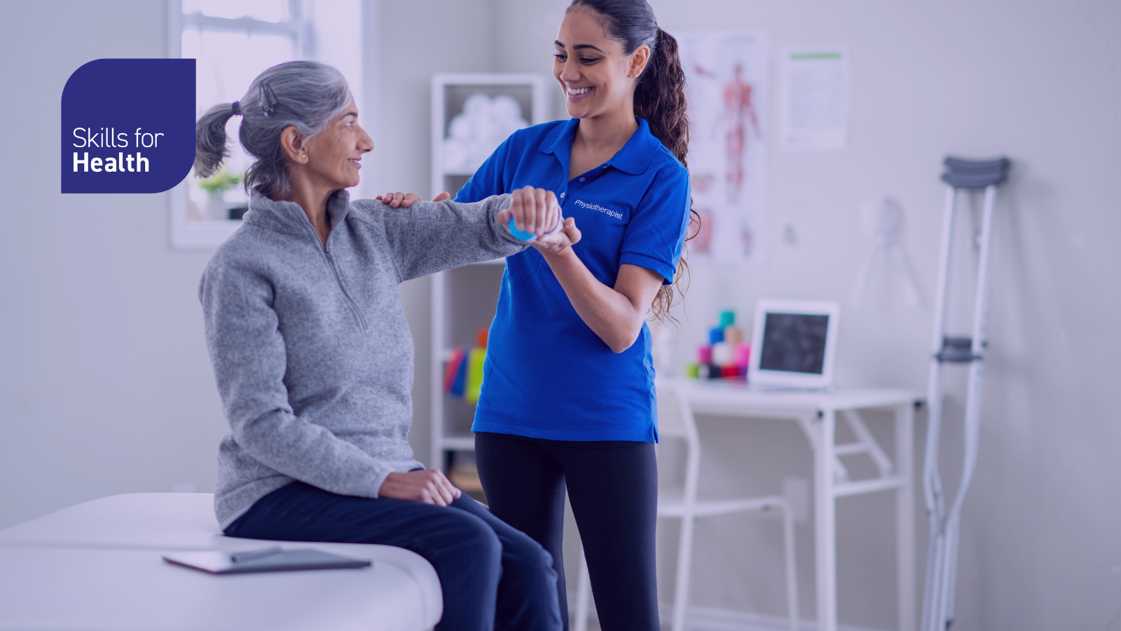 Physio helping patient