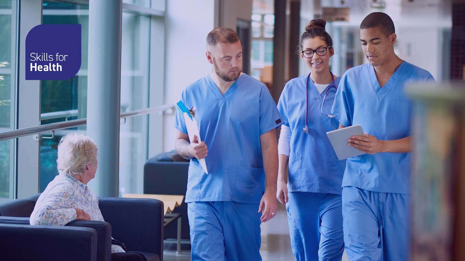 Healthcare staff walking down the corridor of a hospital