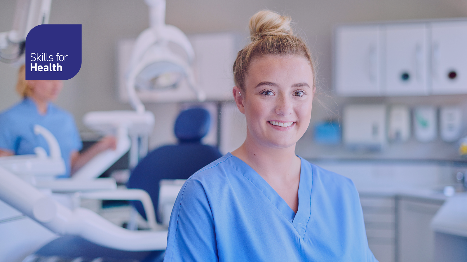 A dental nurse stood in dental surgery